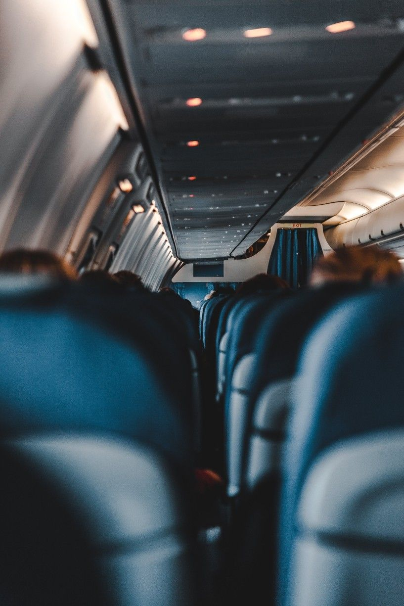 View down the cabin aisle of a commercial aircraft
